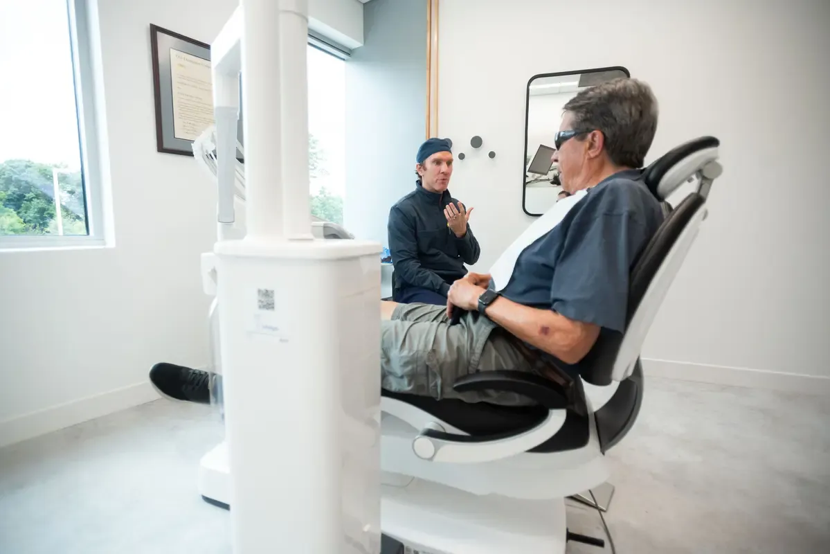 Dr. Forbes consulting with a patient